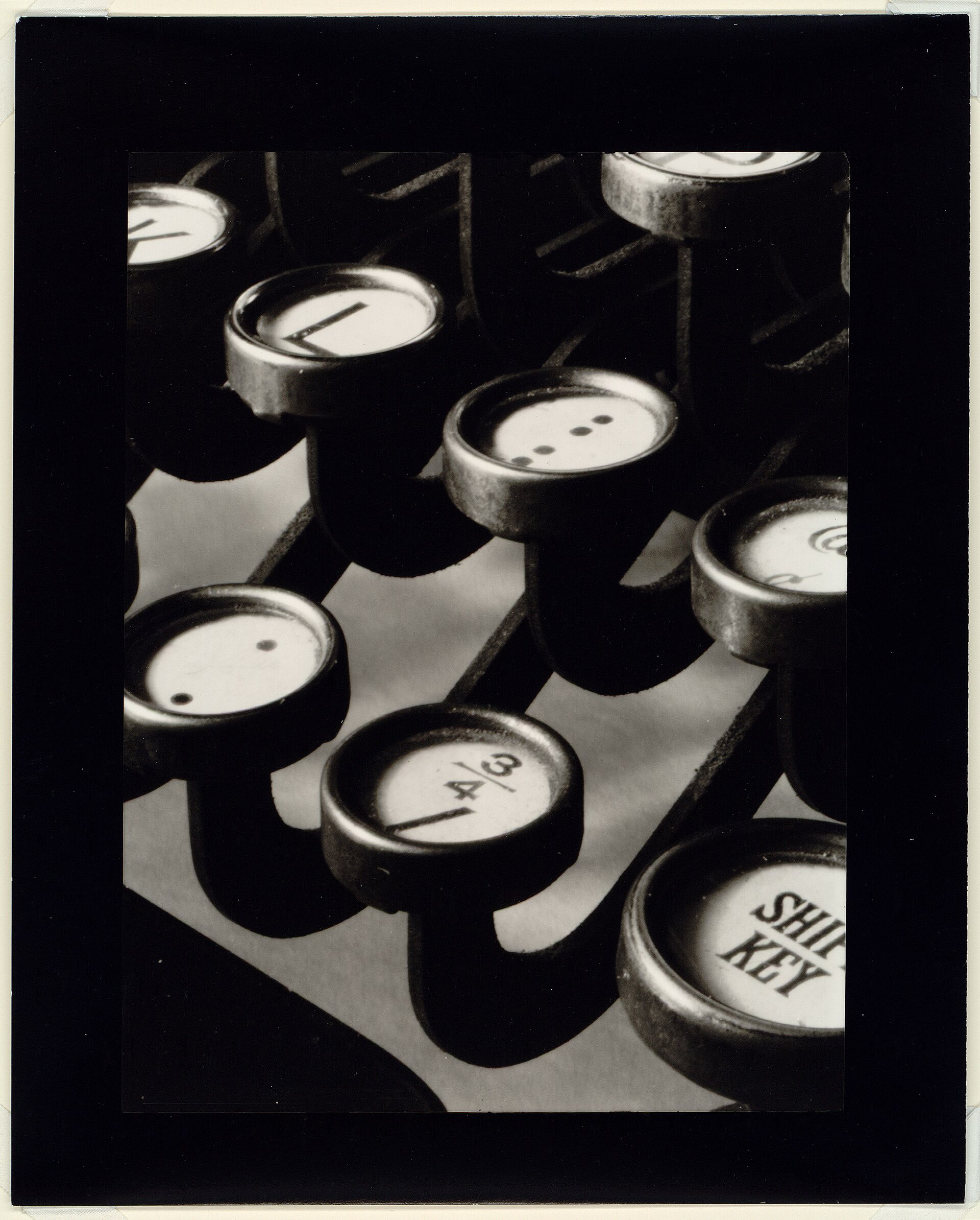Black-and-white close-up of typewriter keys